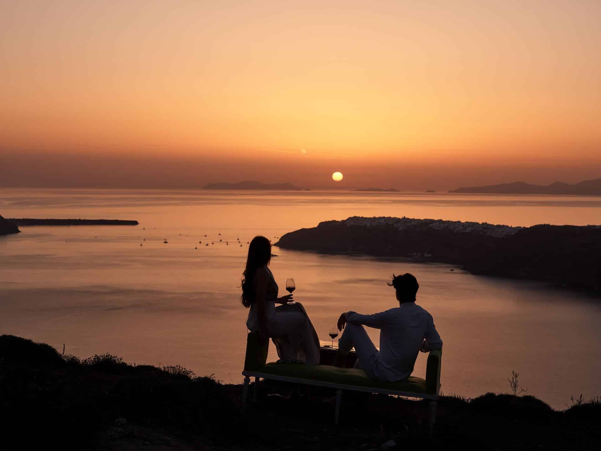 Couple sunset gazing is one of the top things to do in Santorini.