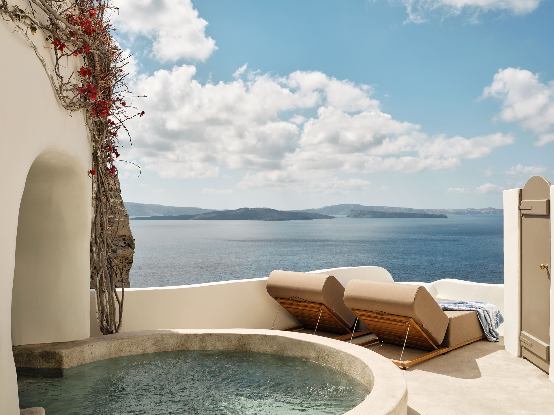 Sea view terrace with private pool and two sunloungers in Andronis Boutique Hotel in Santorini, made for moments that matter.